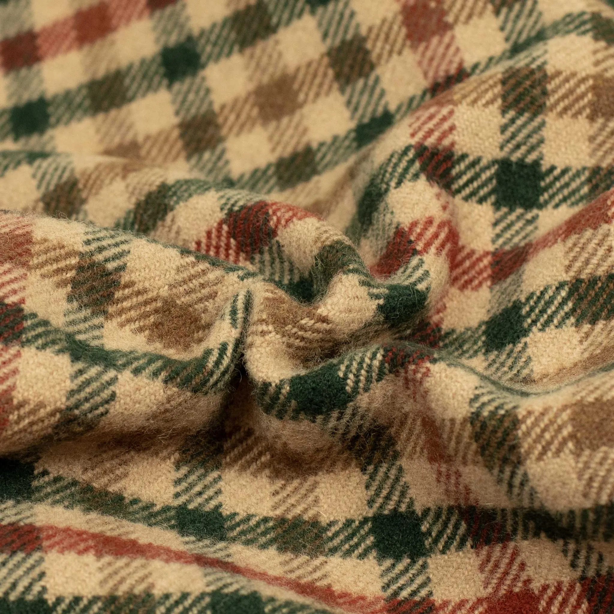 Waxed back picnic blanket in brown, red, and green gunclub lambswool tweed